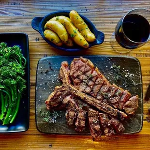 a plate of steak, broccoli and potatoes