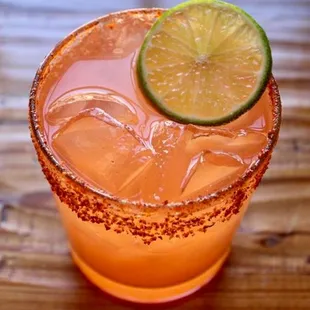 a margarita with a lime slice on top