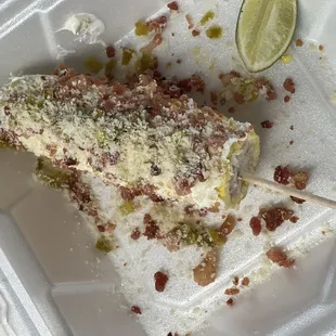 a slice of cake in a styrofoam container