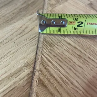 There is a big and uneven gap between counter pieces, which they filled with wood putty. They told us we wouldn't be able to notice.