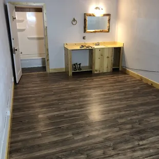 Baseboard and trim as well as the cabinet are custom made from an old fence out back!