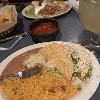 Two Beef Tacos, Mexican Rice, and Refried Beans