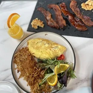 Egg omelette and bacon flight with a side of mimosas!