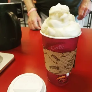 a cup of coffee with whipped cream
