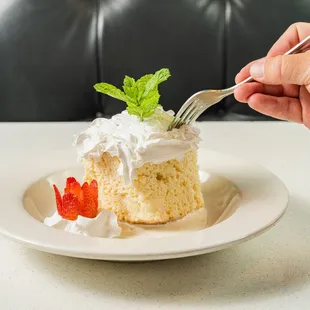 a person eating a piece of cake