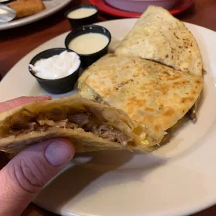 The "Super Quesadilla" with carnitas. 12" flour tortilla.