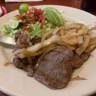 Carne Asada prepared special with no rice or beans and hold the cast iron pan! Very good.