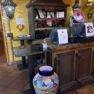  a colorful vase on the counter