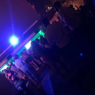 a group of people at a bar