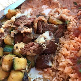 Southwest sizzler steak with zucchini beans and rice $13.99. Lots food!!