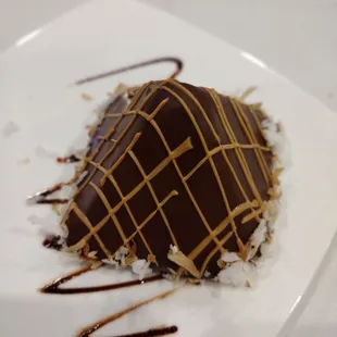 Our $8 dollar desert. I'm so upset. Yes fancy looking, tasted like it was in the fridge for days and not worth $8. So sad.