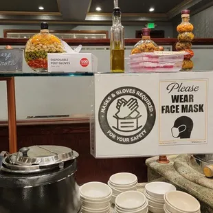 Soup station.  Gloves provided so that you can help yourself at the buffet while practicing safety measures while eating out.  Good move!