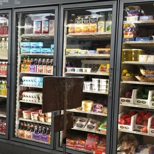 Drinks, dairy products, eggs, and fresh red &amp; green bell peppers among other produce items.