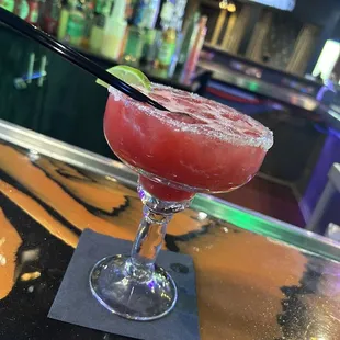 a margarita with a lime garnish
