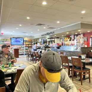 a man sitting at a table eating