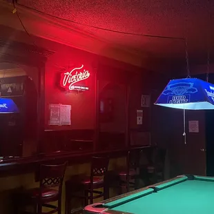 pool table and neon sign