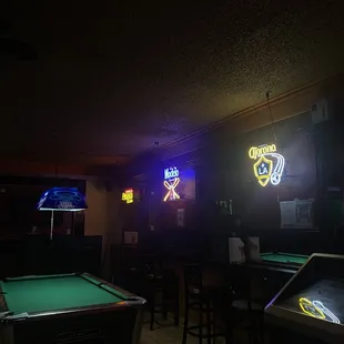 pool tables and neon signs