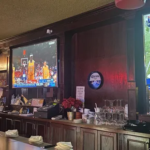 a bar with a large screen tv