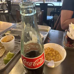 Elote cup and all of the eaten tacos