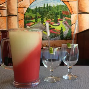 Pitcher of Margarita: half strawberry and half lime