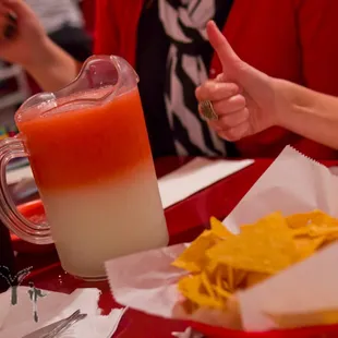 a woman giving a thumbs up