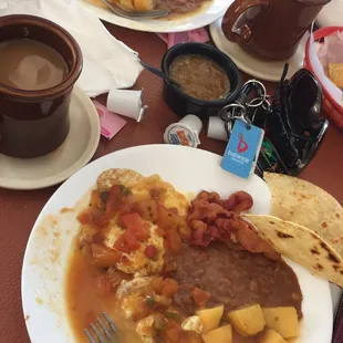 Homemade tortillas. Huevos rancheros &amp; chorizo bk plate. Delicious strong coffee. The salsa is super spicy so watch out!