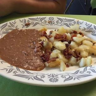 Bacon and potatoes with beans. Tortillas are handmade in the kitchen.