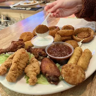 large sampler! onion rings, chicken tendies, wings, mozzarella cheese sticks, fried zucchini, and jalapeno poppers