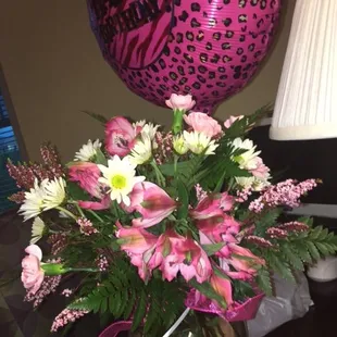 side and back of flowers-wilted from sitting in a hot vehicle- person at the facility brought the flowers to the room, told me very warmvase