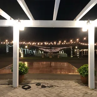 a patio with string lights