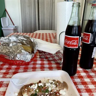 a coke bottle and a plate of food