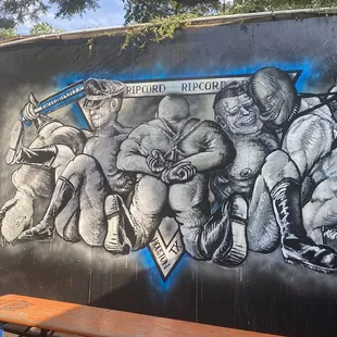 a mural of a group of wrestlers