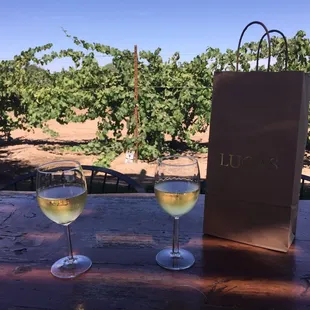 Sipping on the outdoor patio. A chilled chard on a hot day. Pack a picnic and grab a glass of wine!!