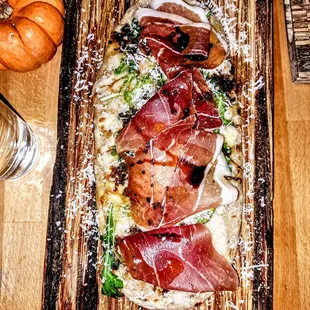 Prosciutto &amp; Arugula Flatbread: Squash, Parmesan, Aged Balsamic. $17