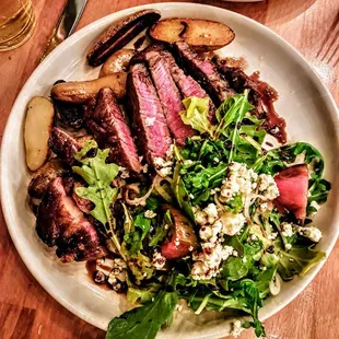 Niman Ranch Boneless Rib-eye (12oz): Heirloom tomato salad, crispy fingerling potatoes, rogue smokey bleu cheese. $41