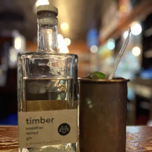 a bottle of gin and a shot glass