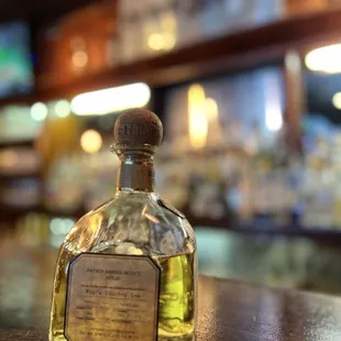 a bottle of liquor on a bar counter