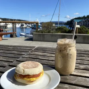 a sandwich and a drink on a table