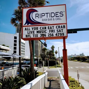 sign for riptides raw bar &amp; grill