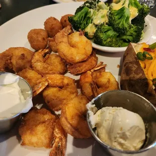 Shrimp Plate with fully loaded baked potato and broccoli with cheese