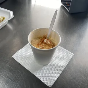 An Esquite with spicy powder on top!