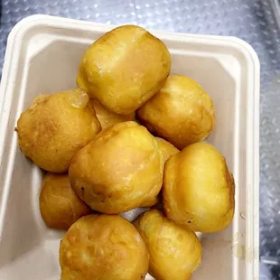 a container of fried donuts