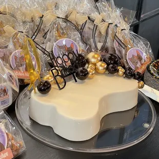 a white cake with chocolate decorations