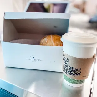 a cup of coffee and a pastry