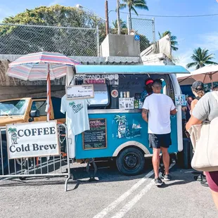 people standing in front of a coffee truck