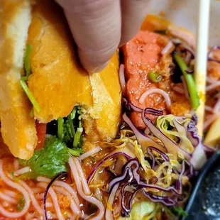 Dipping my Bahn mi into the soup