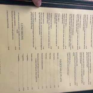 a person holding a menu