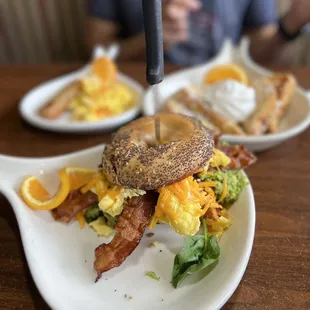 a breakfast sandwich on a white plate