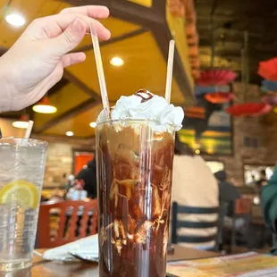 a person reaching for a drink