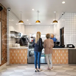 two women standing at the counter